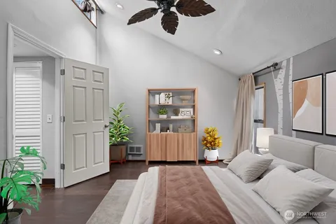 a bedroom with a bed and ceiling fan