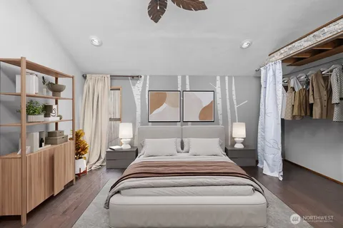 a spacious bedroom with a large bed and a large window