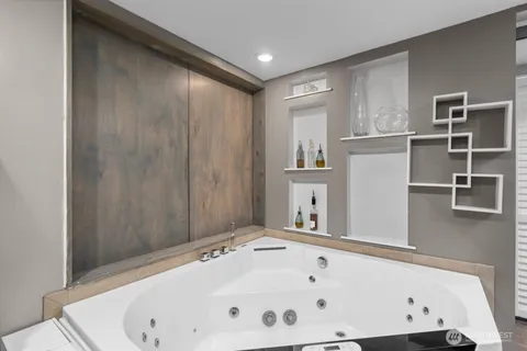 a bathroom with a bathtub and shower