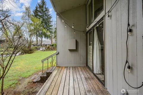 a view of balcony with wooden floor