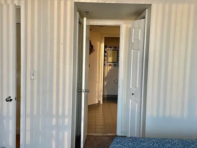 a view of a bathroom from a hallway