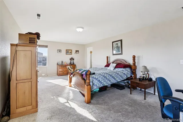 a bedroom with furniture and a bed