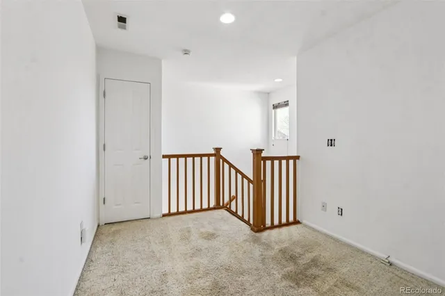 a view of a hallway with entryway