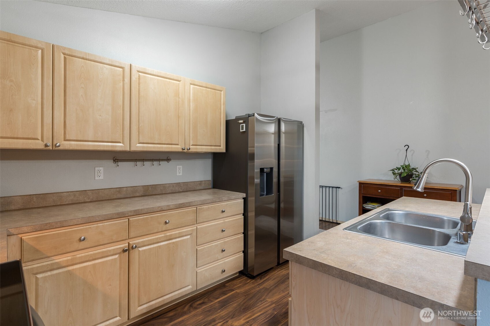 6321 199th Loop Southwest Rochester, WA 98579 - Photo 12 of 38 a kitchen with granite countertop white cabinets and refrigerator