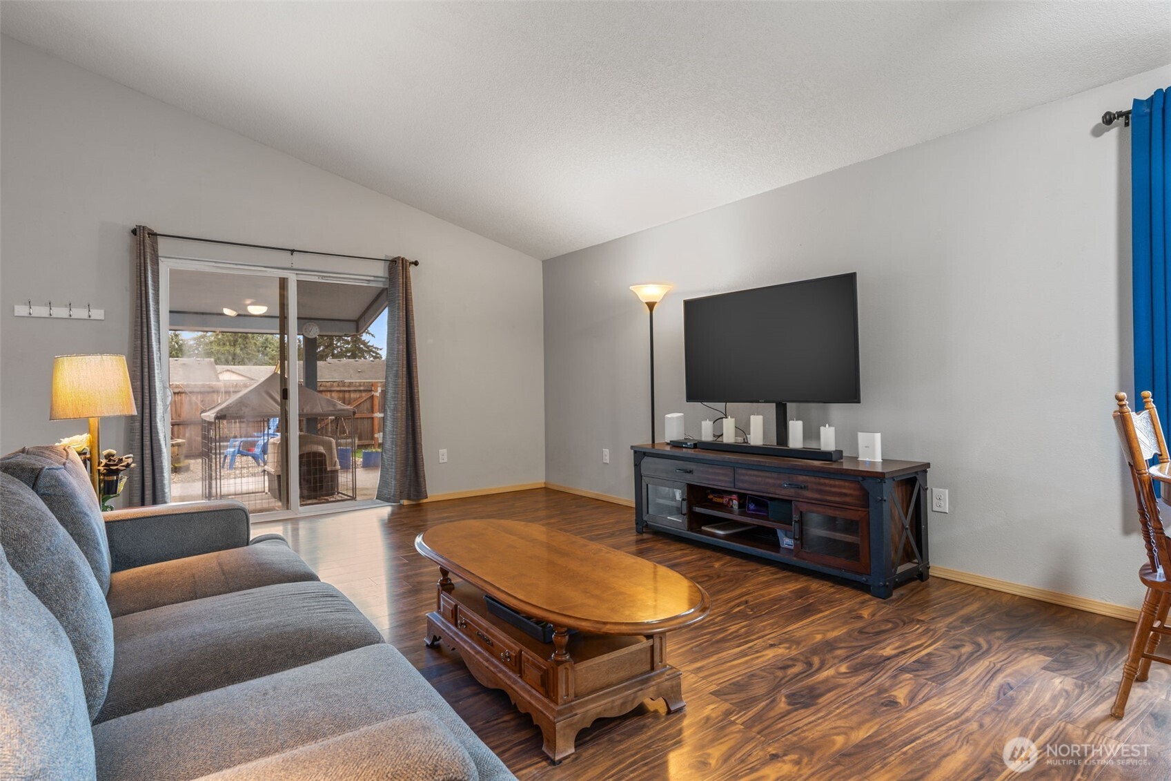 6321 199th Loop Southwest Rochester, WA 98579 - Photo 16 of 38 a living room with furniture and a flat screen tv