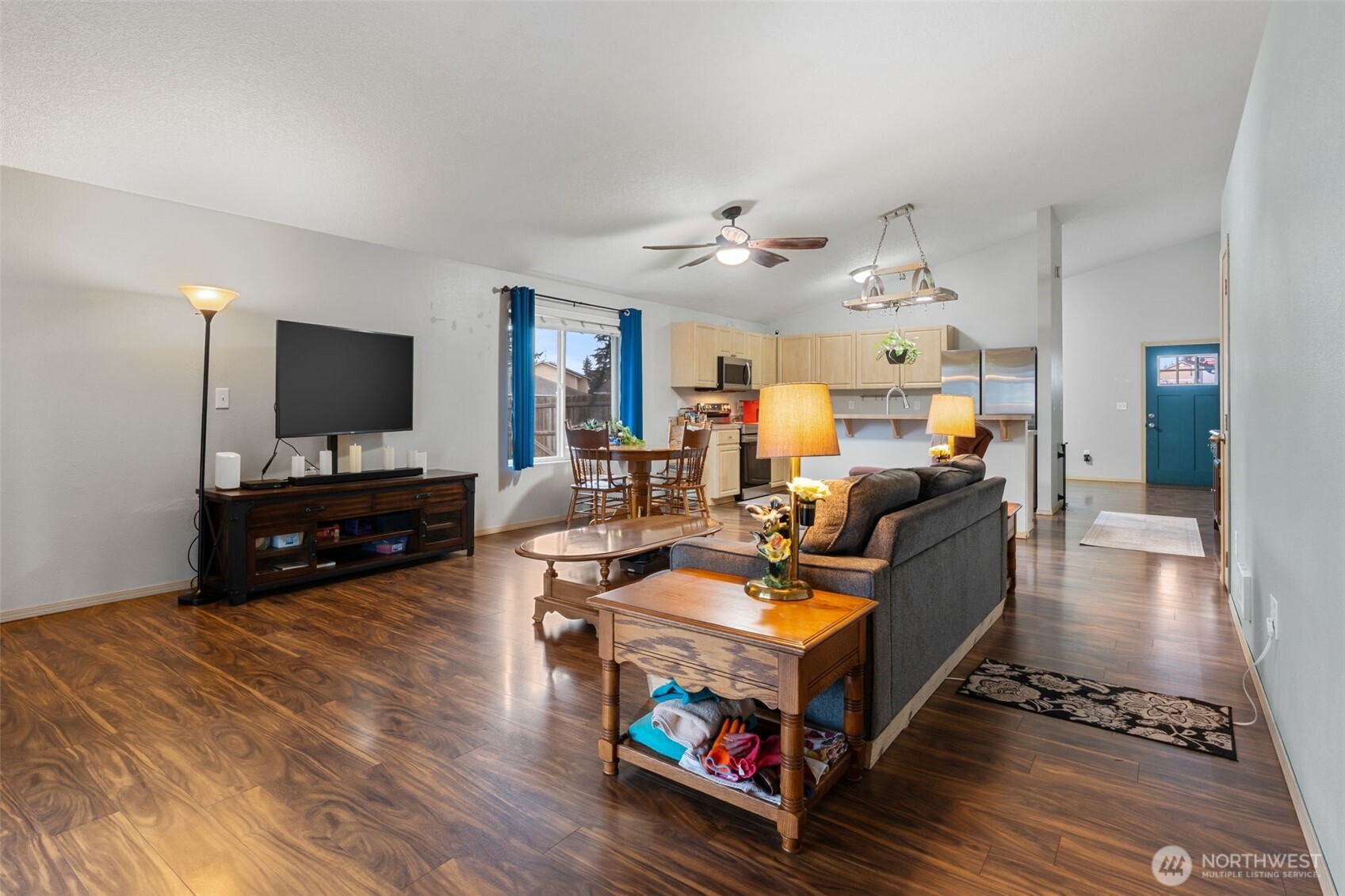 6321 199th Loop Southwest Rochester, WA 98579 - Photo 18 of 38 a living room with furniture and a flat screen tv