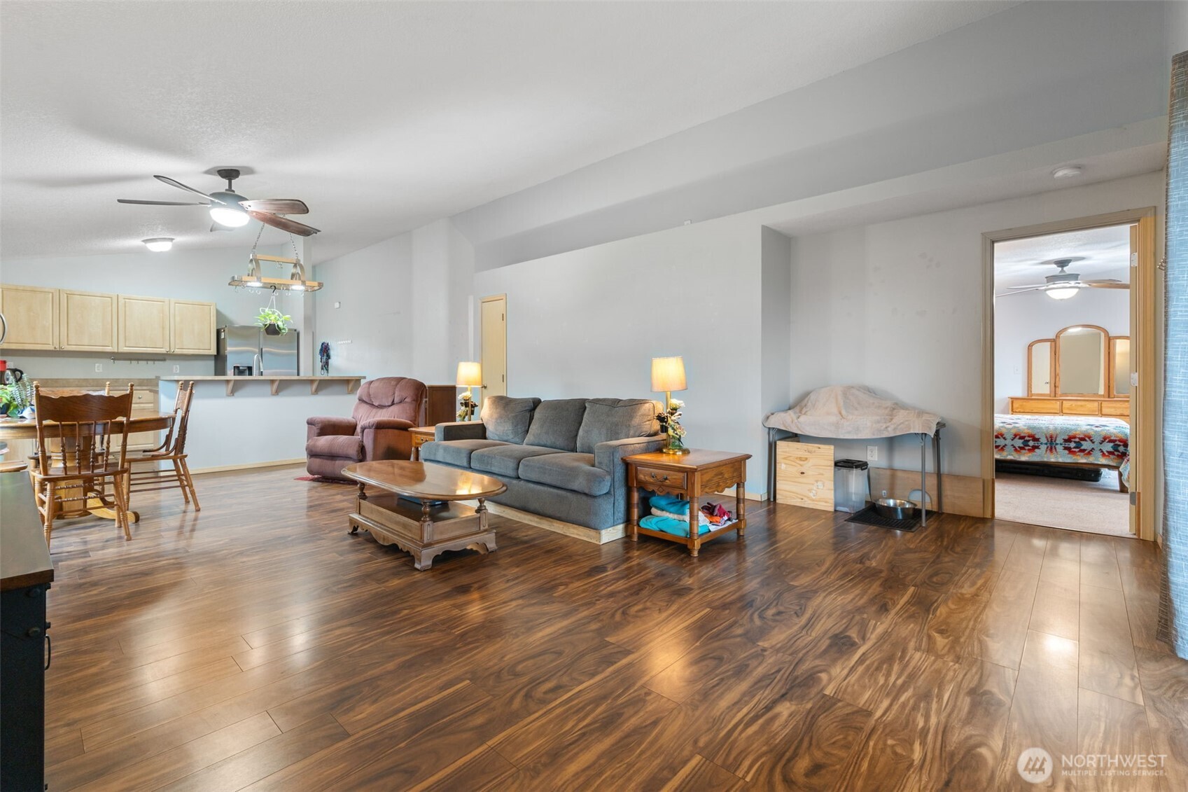 6321 199th Loop Southwest Rochester, WA 98579 - Photo 19 of 38 a living room with furniture and wooden floor