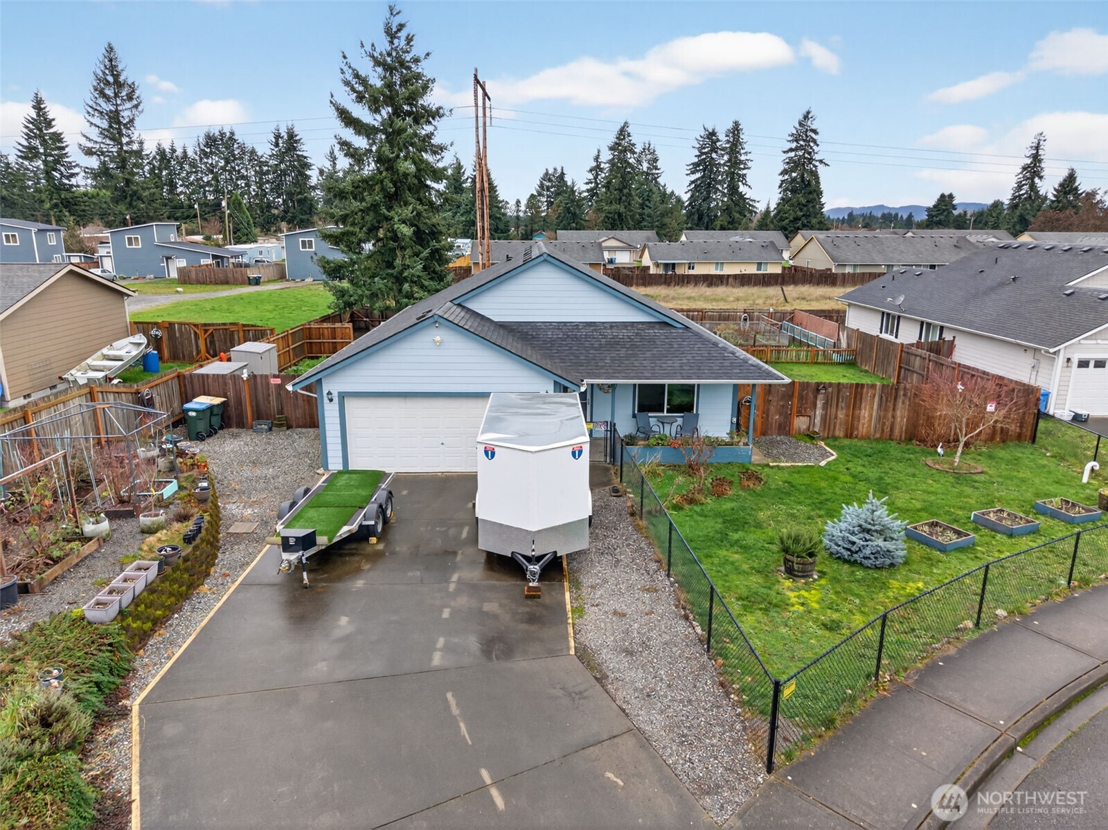 6321 199th Loop Southwest Rochester, WA 98579 - Photo 2 of 38 a aerial view of a house with garden