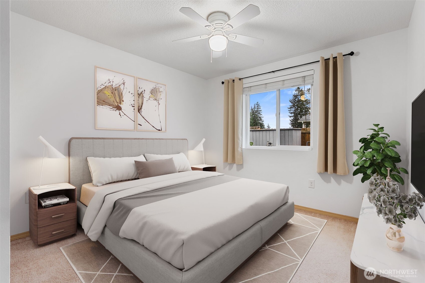 6321 199th Loop Southwest Rochester, WA 98579 - Photo 23 of 38 a bedroom with a large bed and a chandelier