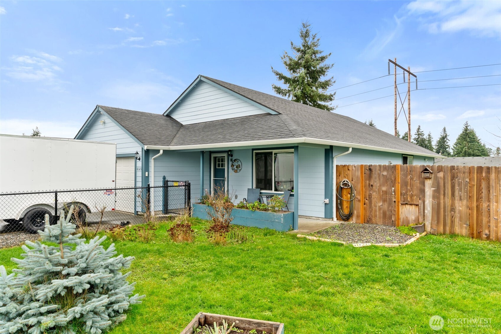 6321 199th Loop Southwest Rochester, WA 98579 - Photo 3 of 38 a front view of a house with garden