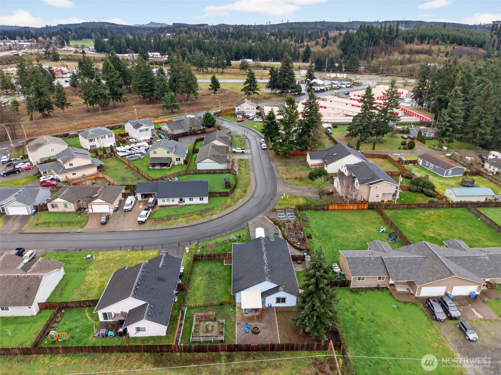 6321 199th Loop Southwest Rochester, WA 98579 - Photo 35 of 38 an aerial view of a house with a swimming pool yard and outdoor seating