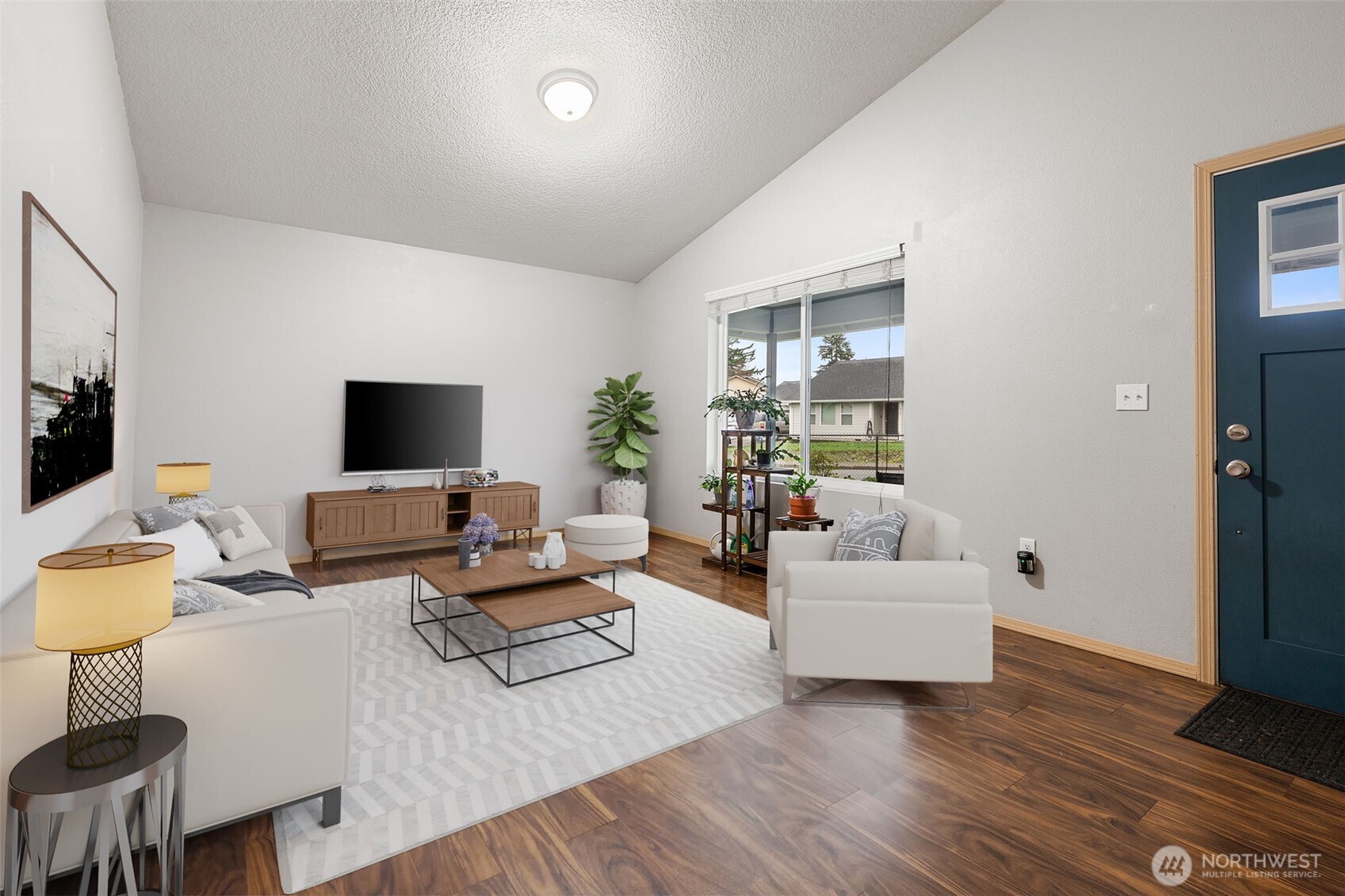 6321 199th Loop Southwest Rochester, WA 98579 - Photo 6 of 38 a living room with furniture and a flat screen tv