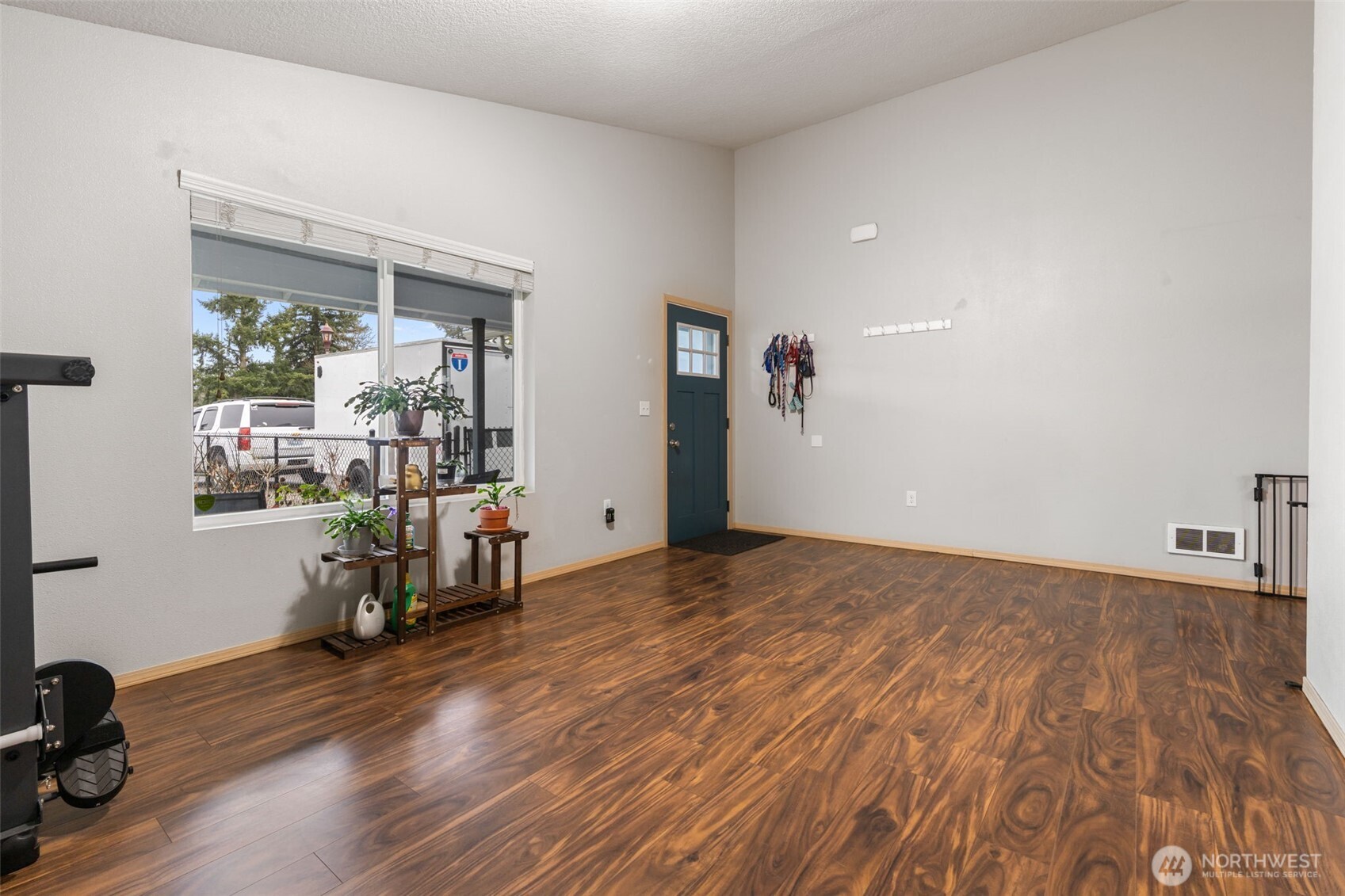 6321 199th Loop Southwest Rochester, WA 98579 - Photo 8 of 38 a view of empty room with wooden floor and fan