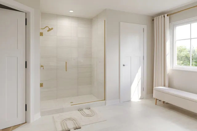 a bathroom with a bathtub and a shower