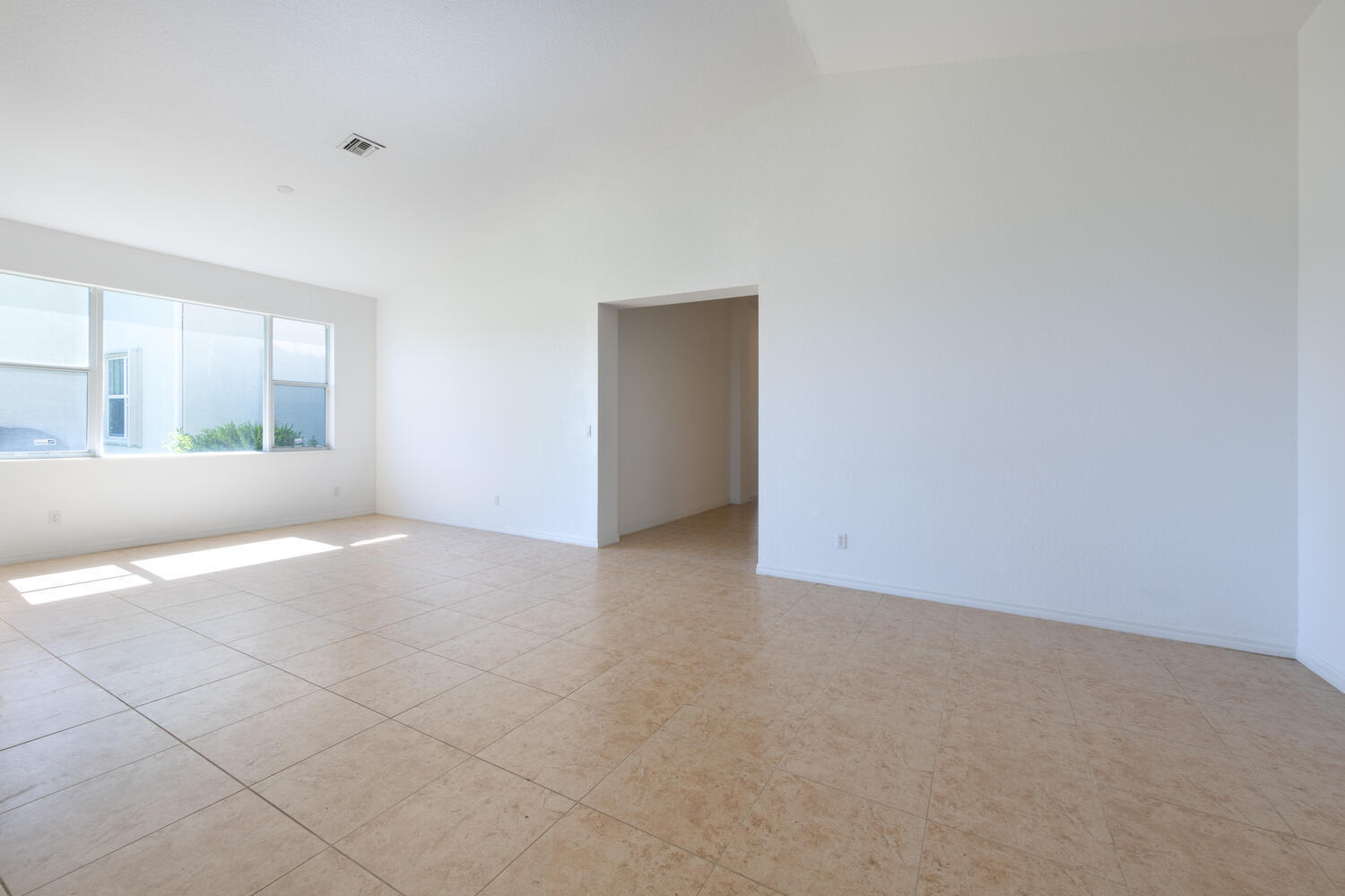 754 Aberfoyle Avenue Fort Pierce, FL 34947 - Photo 6 of 19 an empty room with windows