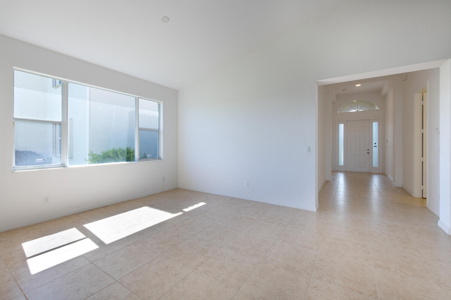 754 Aberfoyle Avenue Fort Pierce, FL 34947 - Photo 9 of 19 a view of an empty room with a window