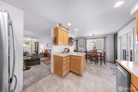 a view of kitchen with furniture and windows
