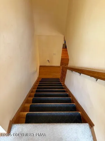 a view of a chairs and table in the balcony