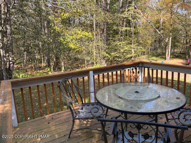 893 Millcreek Road Newfoundland, PA 18445 - Photo 28 of 31 a view of a balcony with a table and chairs