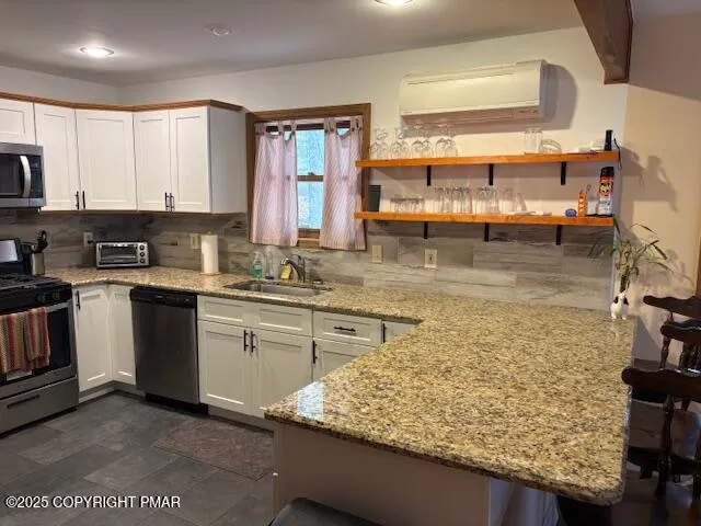 a kitchen with sink cabinets and stove