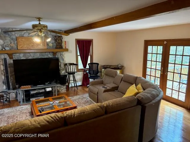 a living room with furniture and a flat screen tv