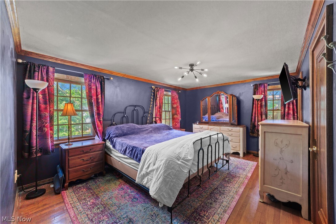 1237 Yellowstone Road Cleveland, OH 44121 - Photo 21 of 48 Bedroom with hardwood / wood-style floors and ornamental molding