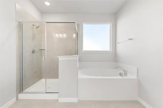a white bath tub sitting next to a shower