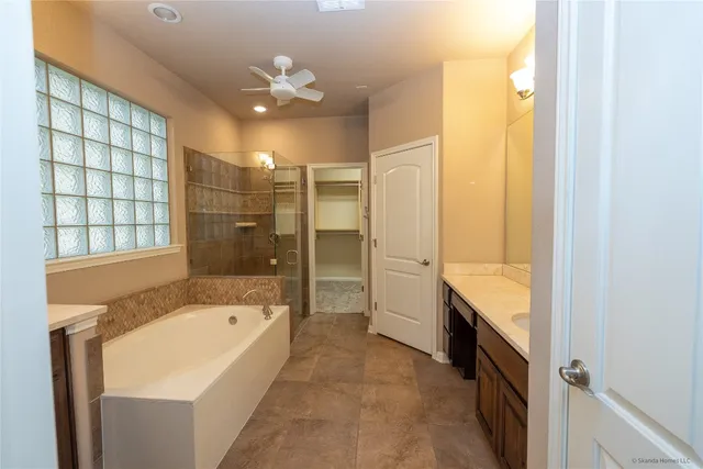 a bathroom with a bathtub and a shower