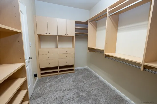 a view of an empty room and cabinet