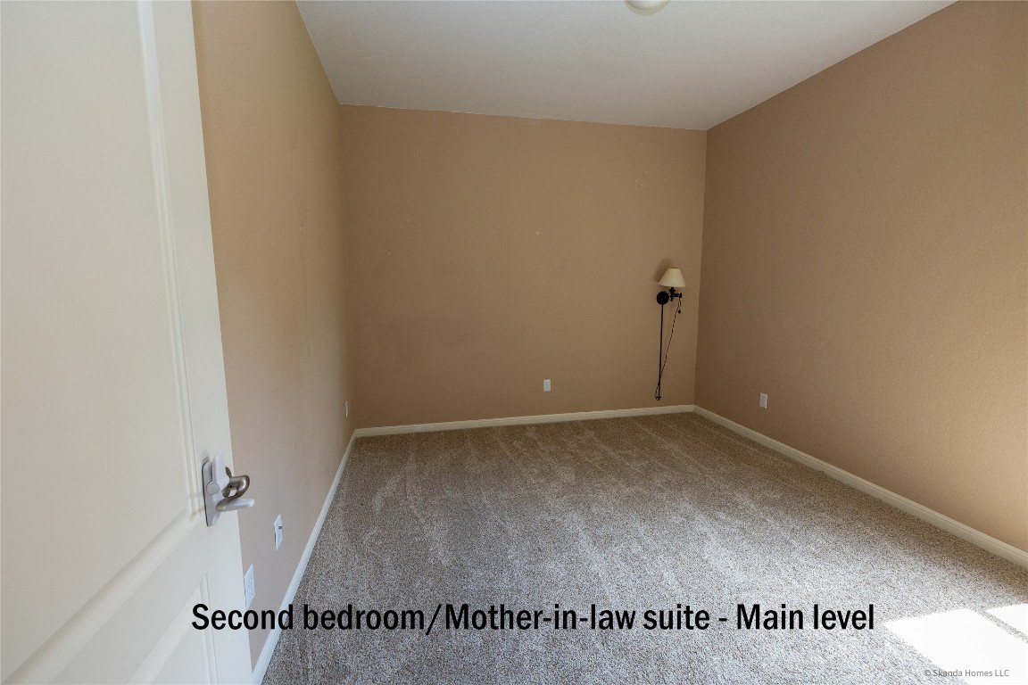 104 Palisades Cove Austin, TX 78732 - Photo 16 of 27 Carpeted empty room featuring baseboards