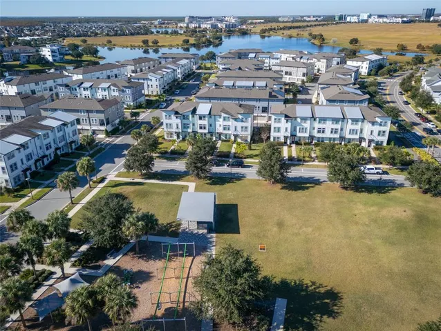 an aerial view of a residential building with outdoor space
