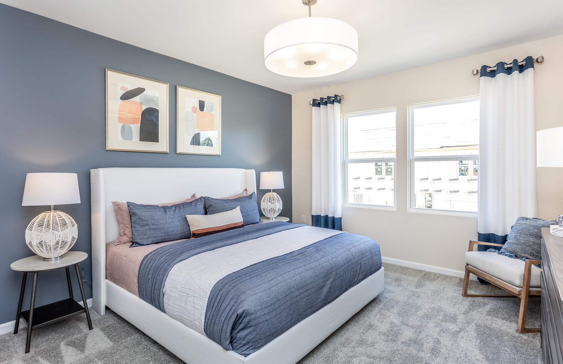 3521 New Town Road Raleigh, NC 27604 - Photo 12 of 18 a bedroom with a bed and a chandelier