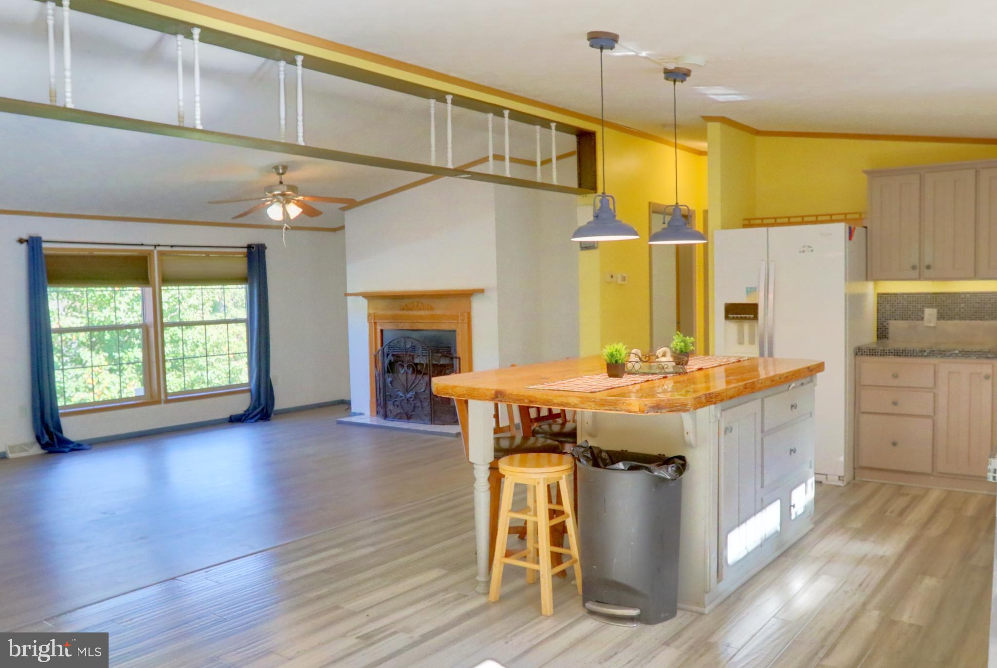 15792 Cross Mill Road Felton, PA 17322 - Photo 14 of 33 a kitchen with a table chairs sink and cabinets