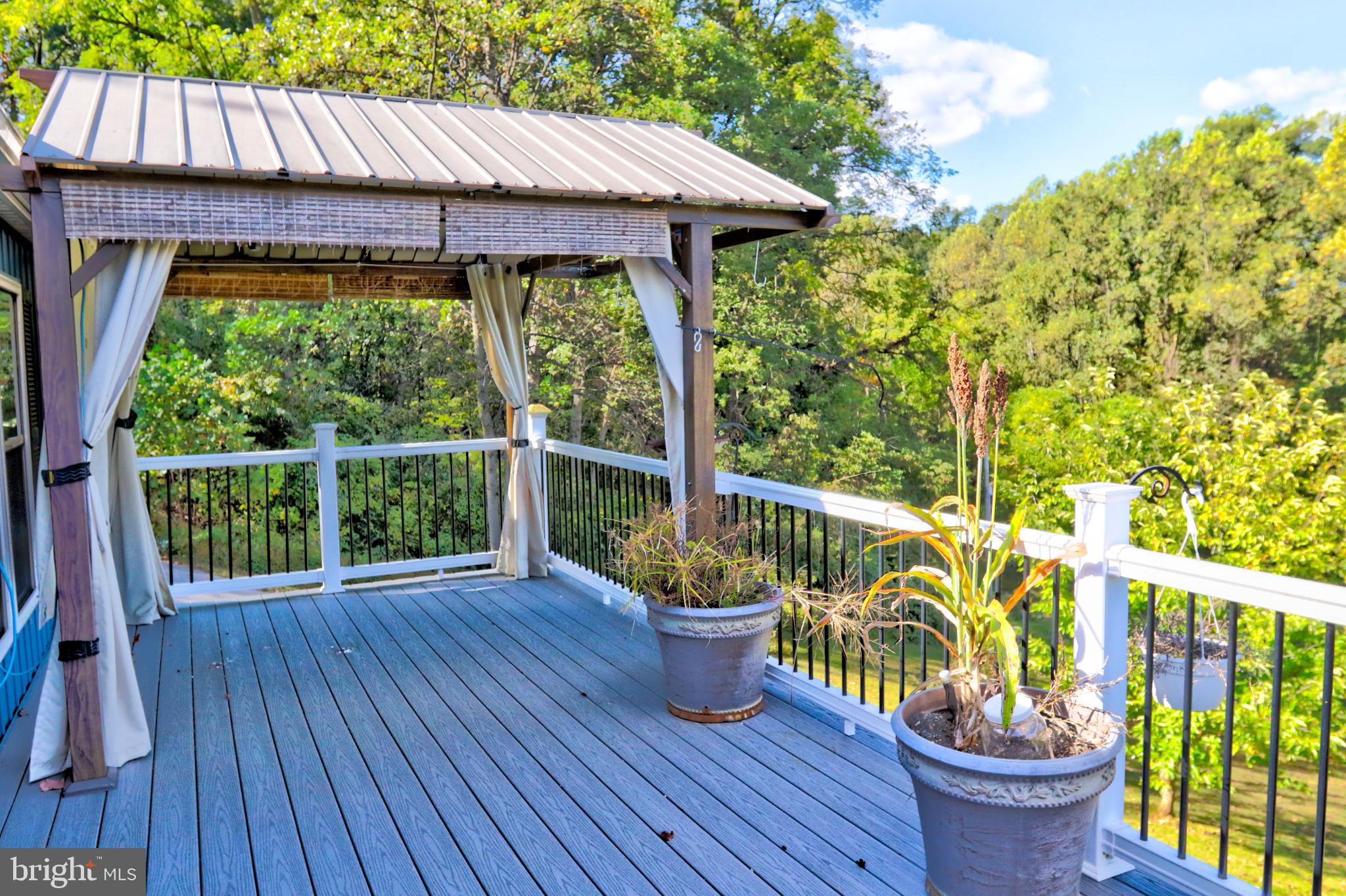 15792 Cross Mill Road Felton, PA 17322 - Photo 10 of 33 a view of a deck with wooden floor barbeque oven and outdoor seating