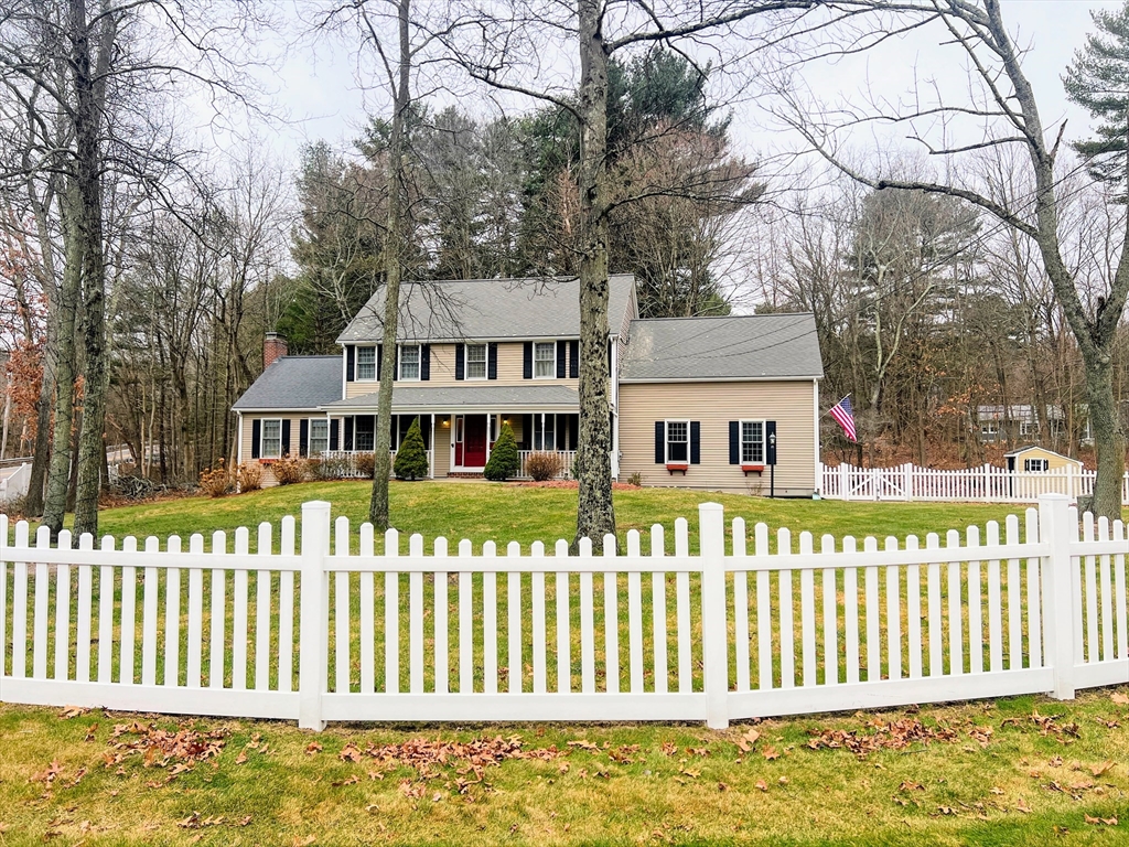 1565 West Street Wrentham, MA 02093 - Photo 2 of 41 a front view of a house with a garden