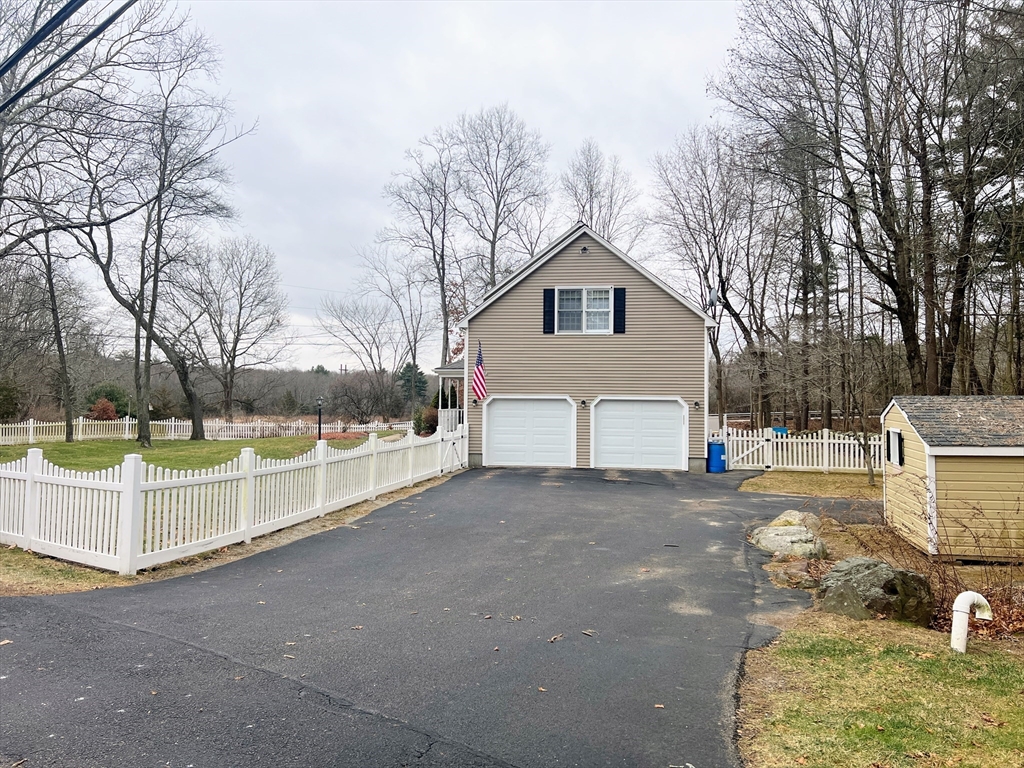 1565 West Street Wrentham, MA 02093 - Photo 37 of 41 a view of a house with a yard covered in snow