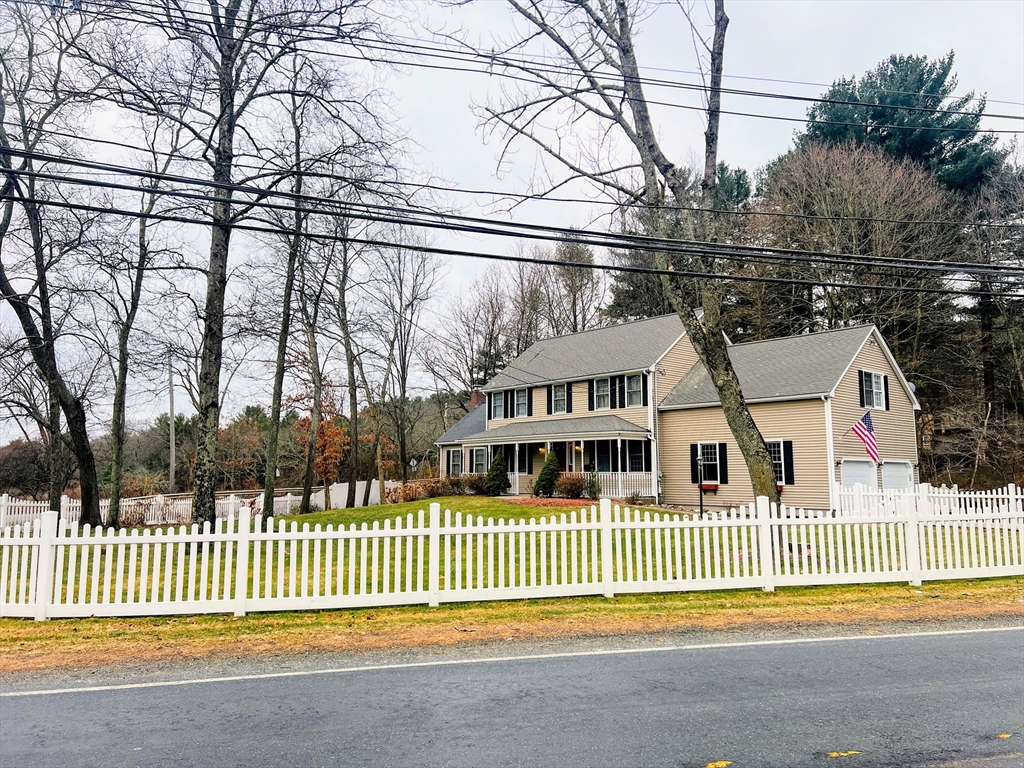 1565 West Street Wrentham, MA 02093 - Photo 39 of 41 a view of a white house in a back yard