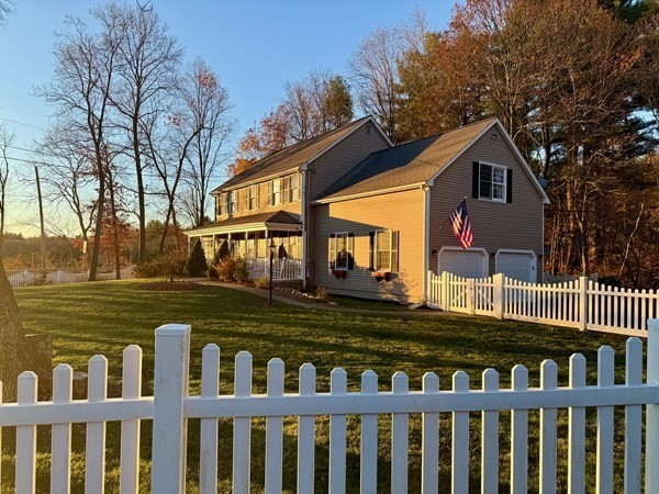 1565 West Street Wrentham, MA 02093 - Photo 41 of 41 a front view of a house with a garden