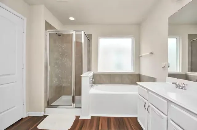 a bathroom with a sink a mirror and a bathtub