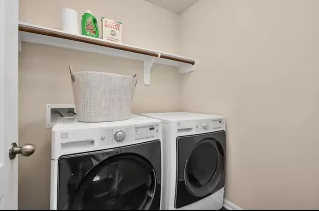 a utility room with dryer and washer