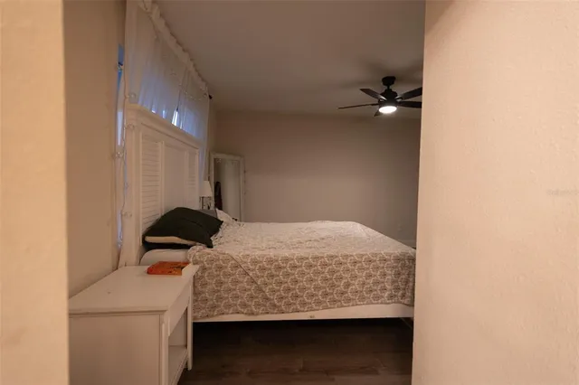 a room with a bed and a chandelier