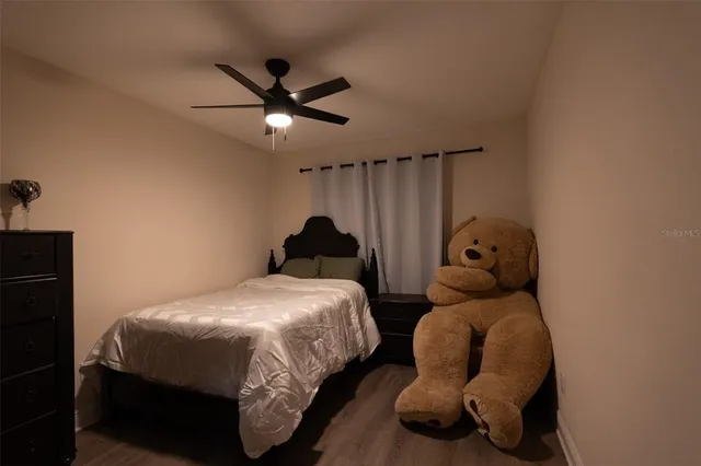 a bedroom with two beds and painted walls