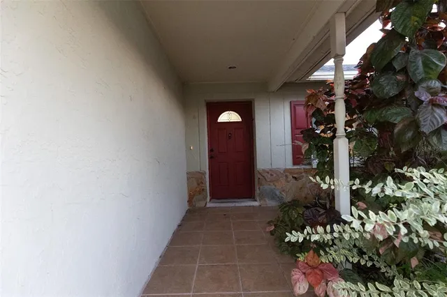 a view of a house with a flower garden