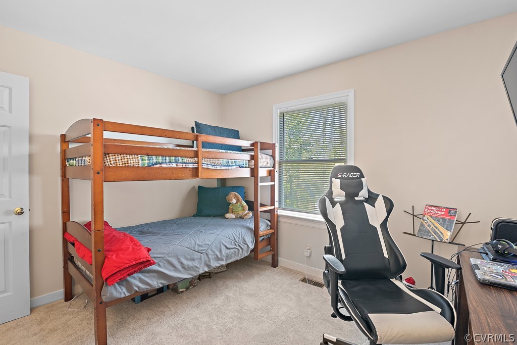 13906 Turtle Hill Road Midlothian, VA 23112 - Photo 33 of 35 a bedroom with furniture and a gym machine