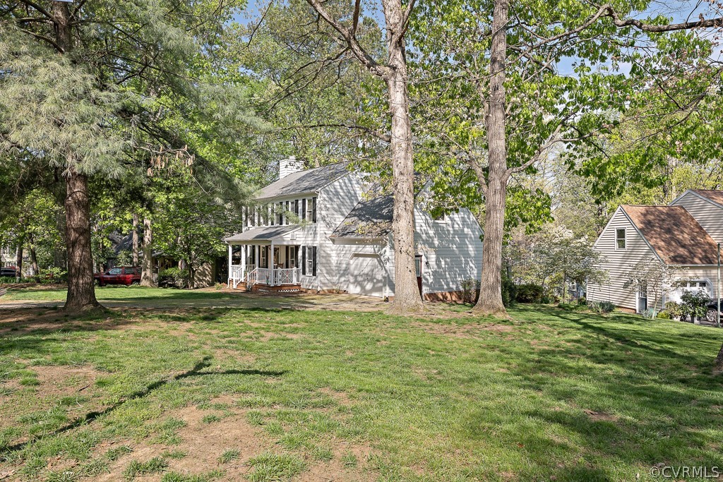 13906 Turtle Hill Road Midlothian, VA 23112 - Photo 4 of 35 a front view of a house with a garden
