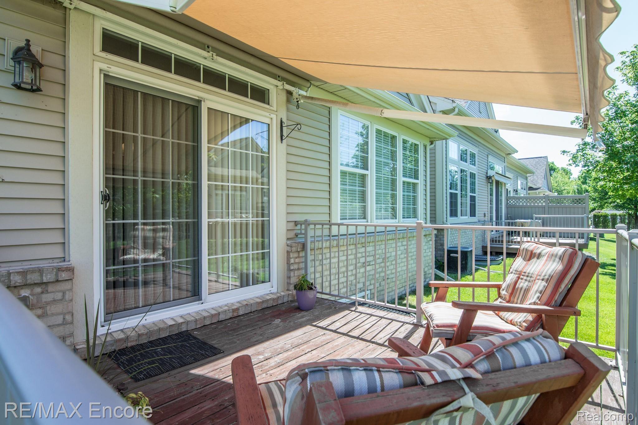6135 Timberstone Way Clarkston, MI 48346 - Photo 28 of 31 Deck with Retractable Awning