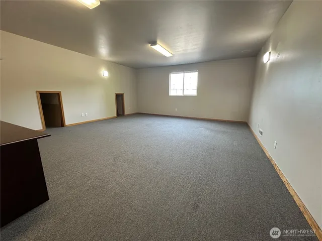 a view of an empty room with a window