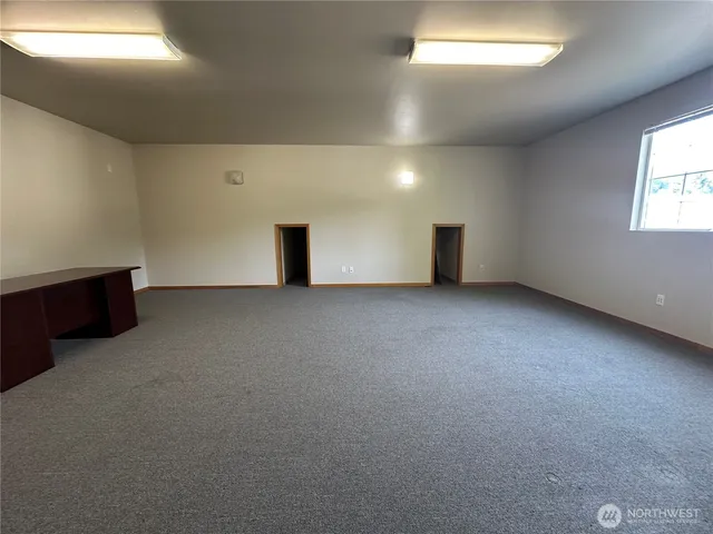 an empty room with windows