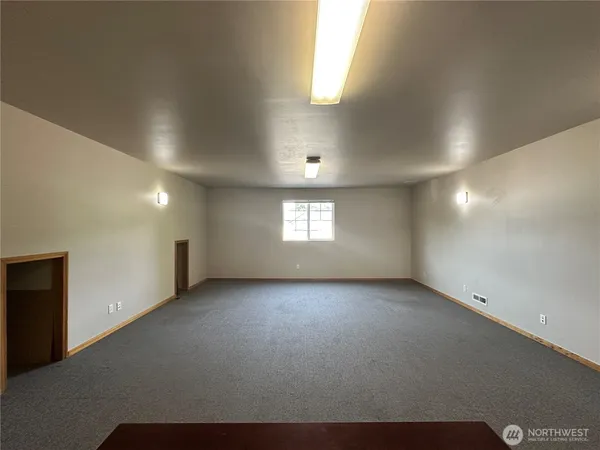 a view of an empty room with a window