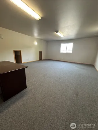 a view of empty room with windows